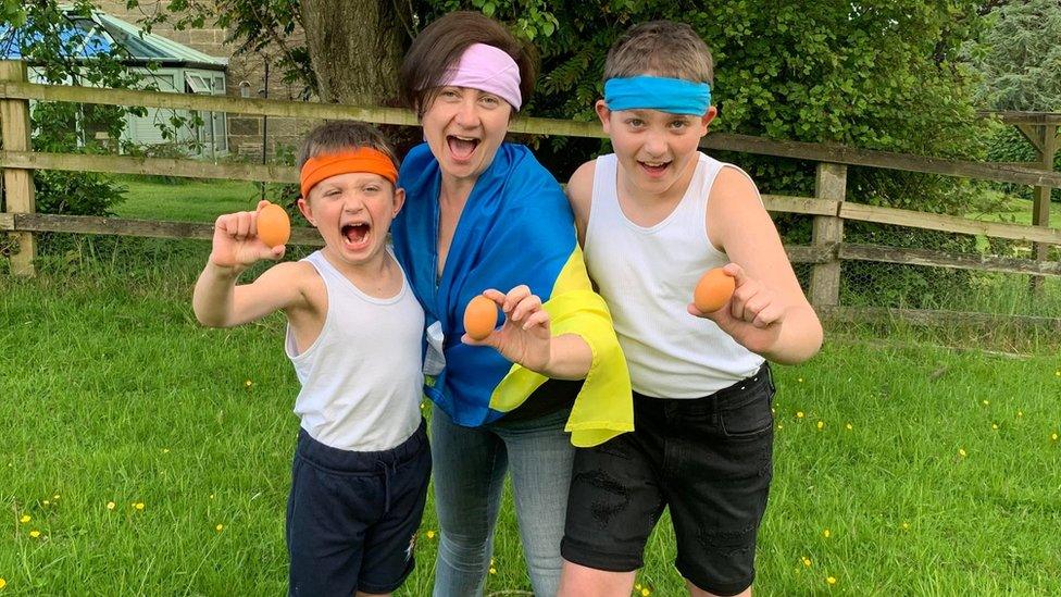 Igor, 7, Tykhon, 12, and mum Victoriia