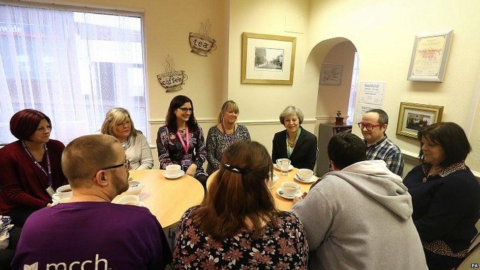 Theresa May meets volunteers from the Wellbeing Centre in Aldershot, Hampshire