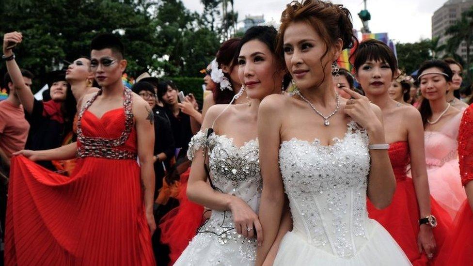 Two participants pose during the annual Taiwan lesbian, gay, bisexual and transgender pride parade in Taipei on 29 October 2016.