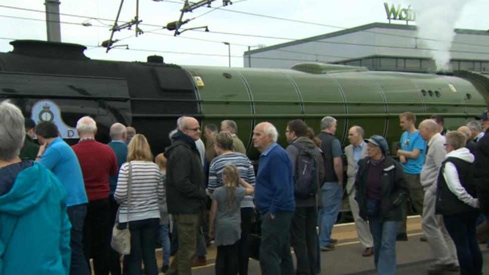 Passengers standing by Tornado