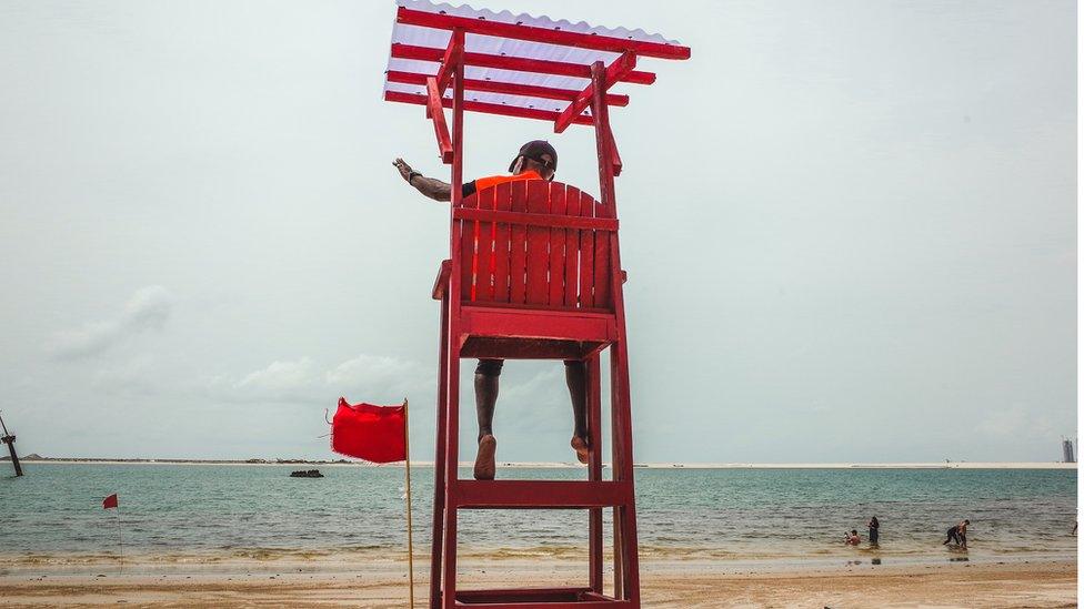 Stephen Boboly on lifeguard chair on Landmark Beach, Lagos, Nigeria