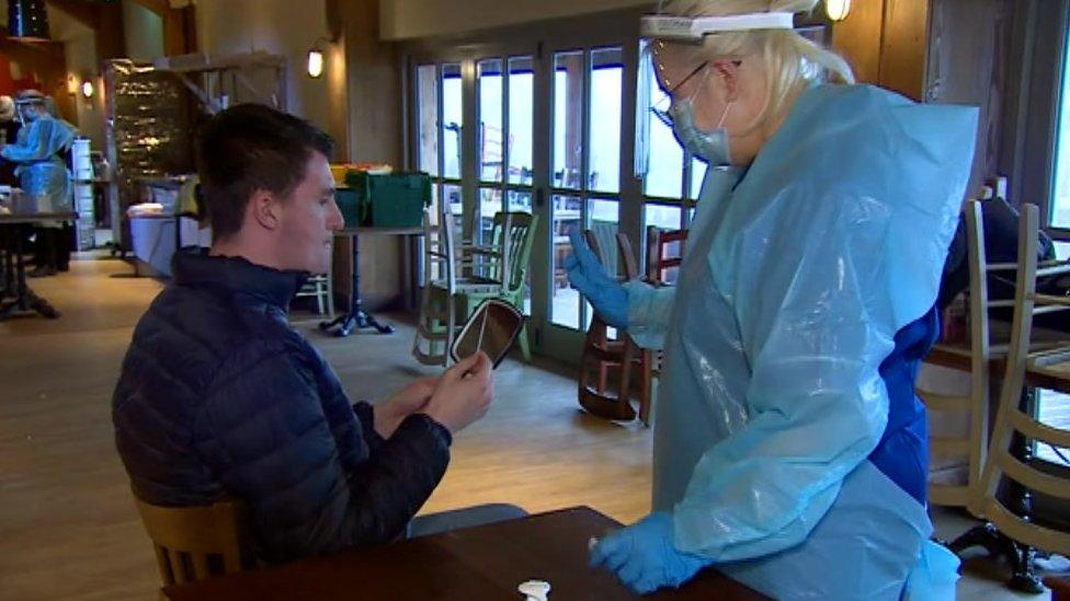 Man holding swab about to do test