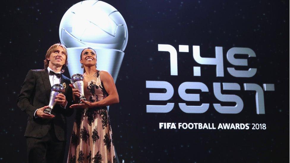 Tottenham Hotspur and Croatia star Luca Modric and Marta accept their awards