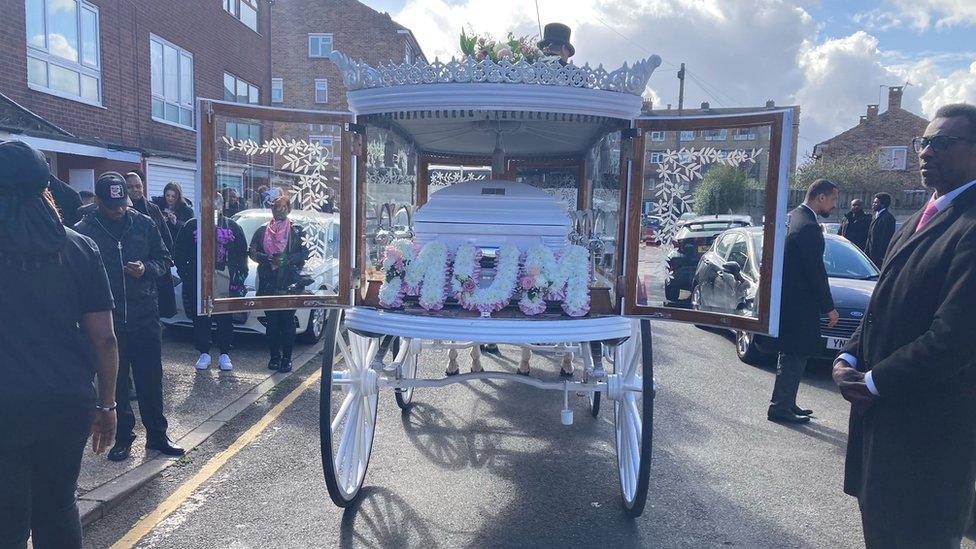 Ms Ikumelo's coffin arrived in a carriage led by white horses