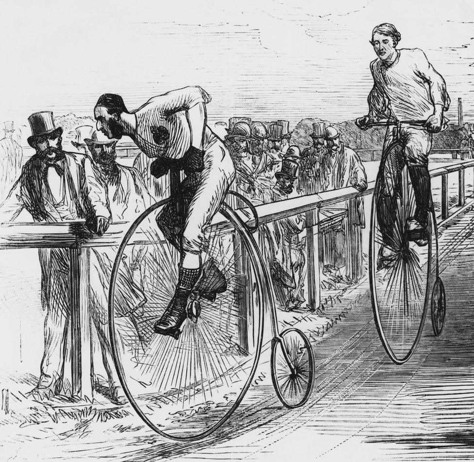 An engraving showing a Penny Farthing bicycle race in London, circa 1860