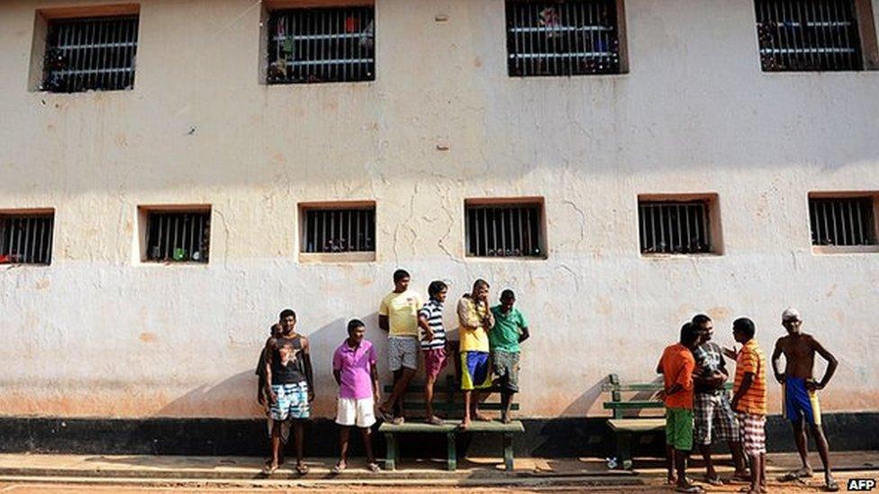 Sri Lankan prisoners look on during an event to celebrate Sinhalese and Tamil New Year at a prison complex in Colombo on April 24, 2013