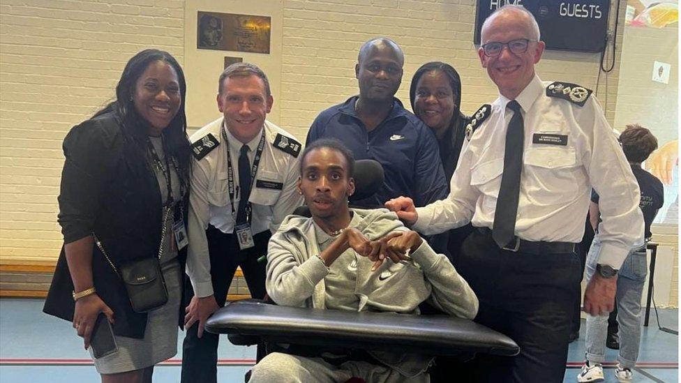 James with his aunt Rachel (left), mum Lisa (right) and Met Police commissioner Sir Mark Rowley (right)