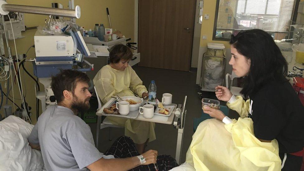 Pyotr Verzilov, left, speaks to Pussy Riot founder Nadezhda Tolokonnikova in hospital