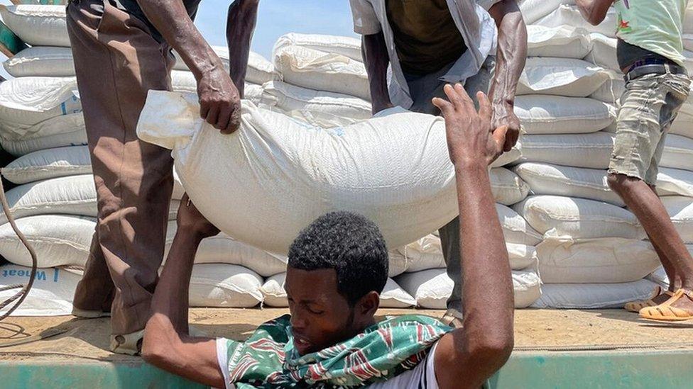 Sacks of food being unloaded in Zelazle, Tigray