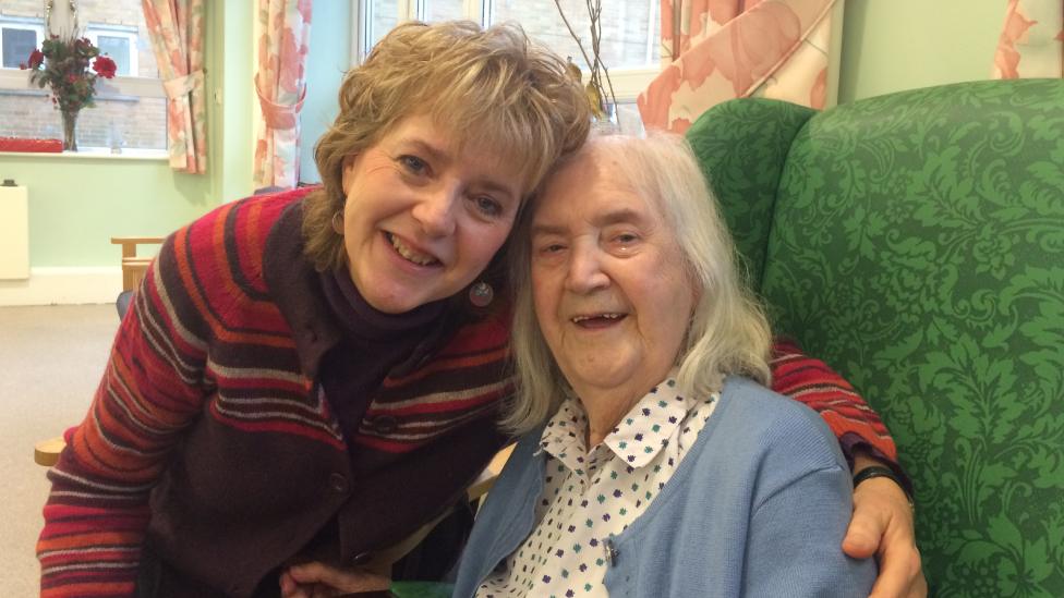 Jacqueline Bright and her mother smiling and hugging before the pandemic hit