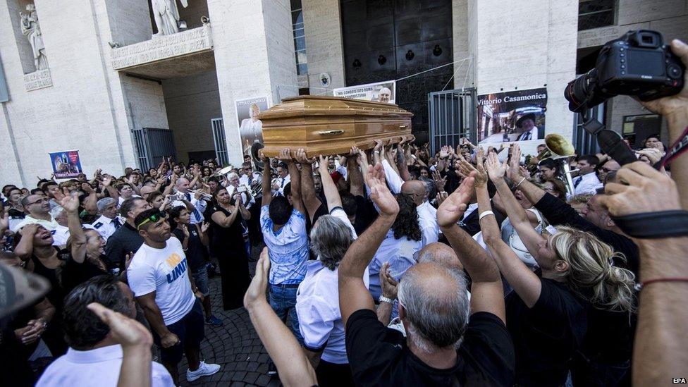 People attend the funeral procession of alleged mafia member Vittorio Casamonica, outside Don Bosco church in Rome, Italy, 20 August 2015