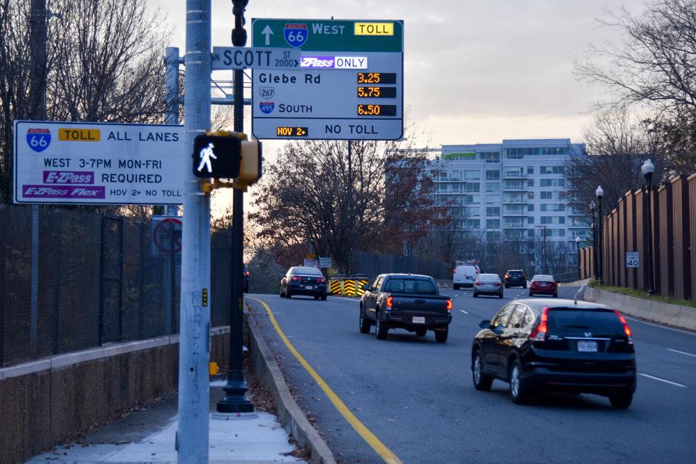 A sign showing variable pricing for drivers who want to use part of Interstate 66 in Arlington, Virginia, during rush hour