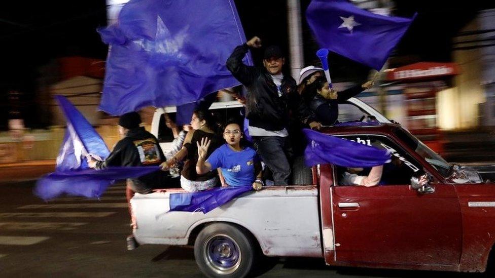 Supporters of President and National Party presidential candidate Juan Orlando Hernandez take part in a vehicle caravan rally as they wait for official presidential election results in Tegucigalpa, Honduras, November 27, 2017.