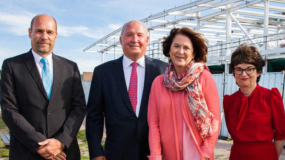 The parents with university principal and professor