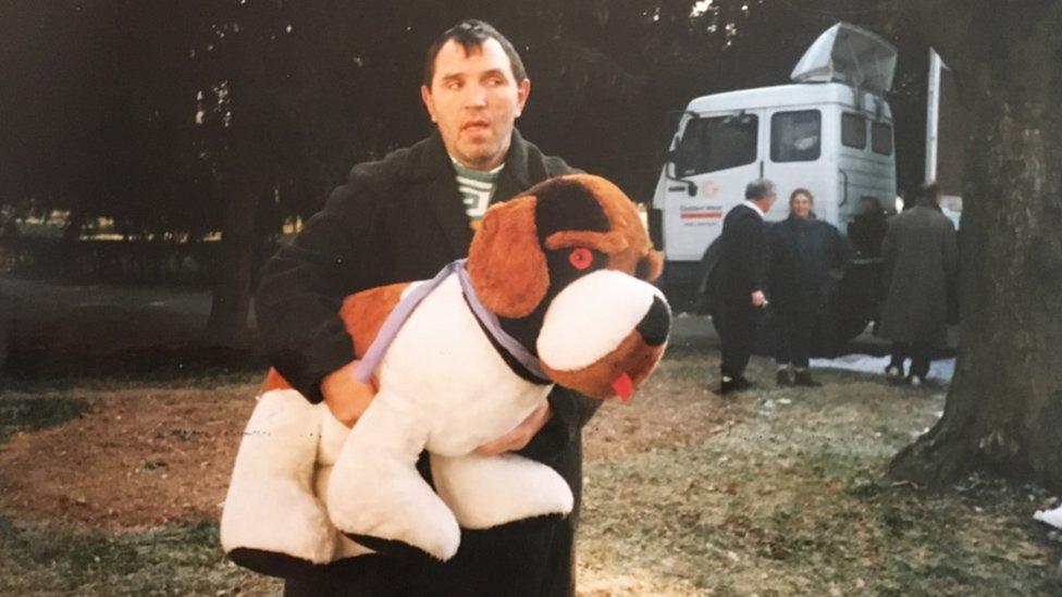 A Croatian hospital patient carrying a toy dog