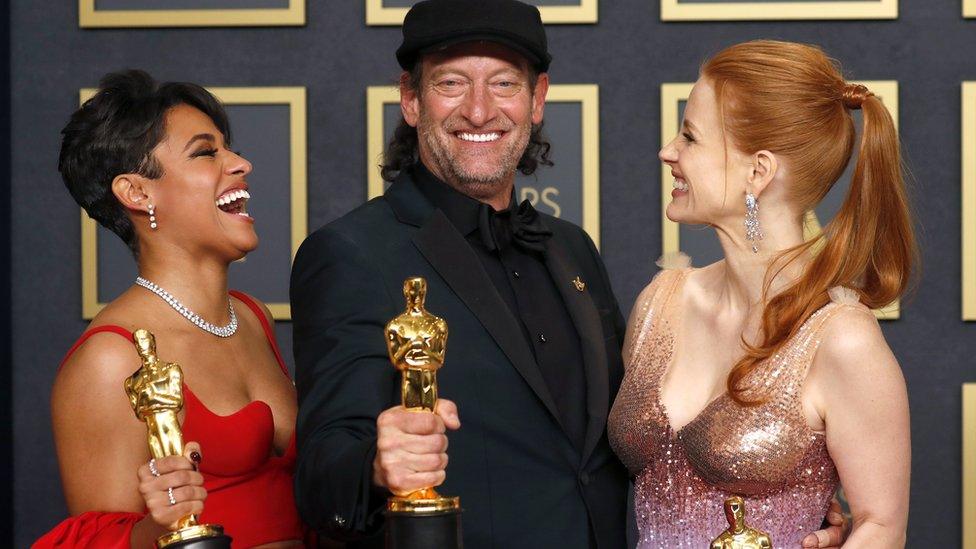 Ariana DeBose (left) and Jessica Chastain with Troy Kotsur and their Oscars