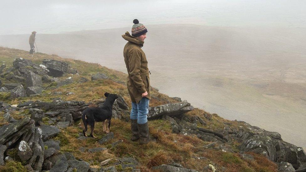 Men on Ingleborough in Yorkshire Dales