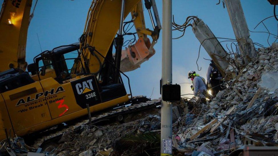 Rescue crews on the pile of rubble