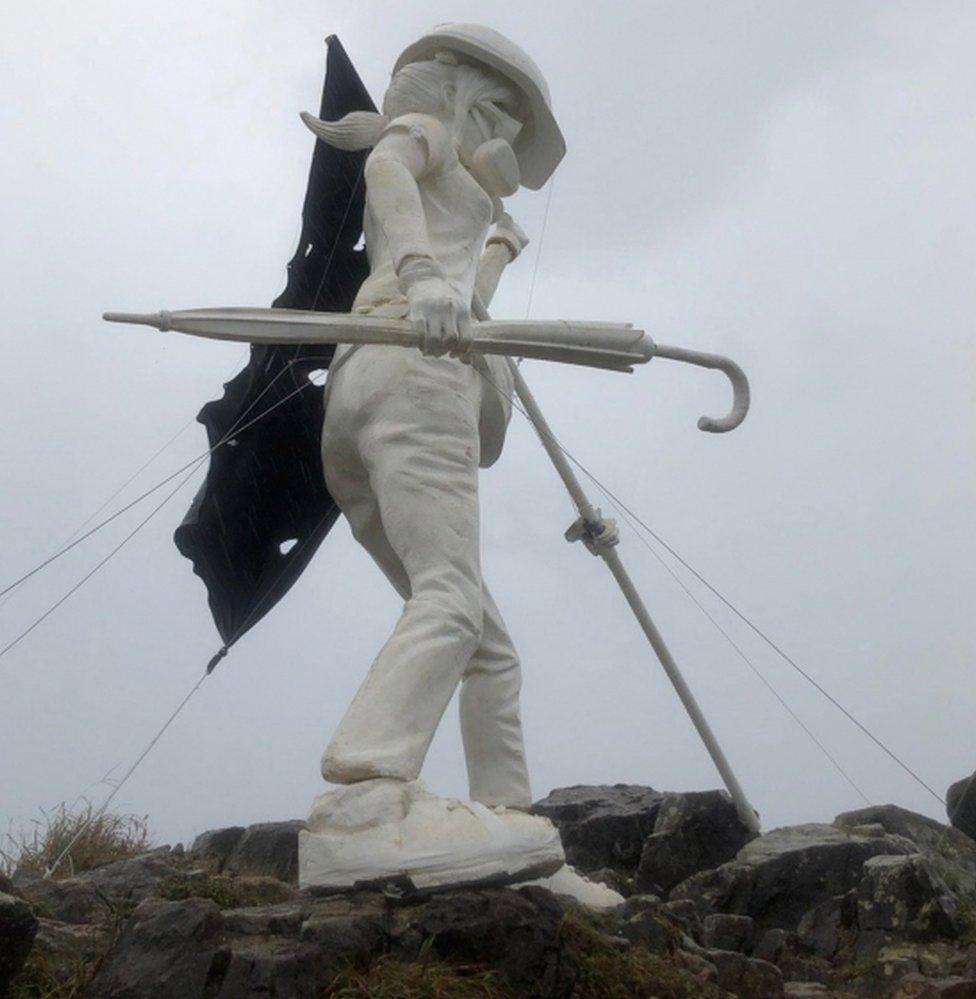 The "statue of Lady Liberty Hong Kong" stands on Hong Kong's famous Lion Rock