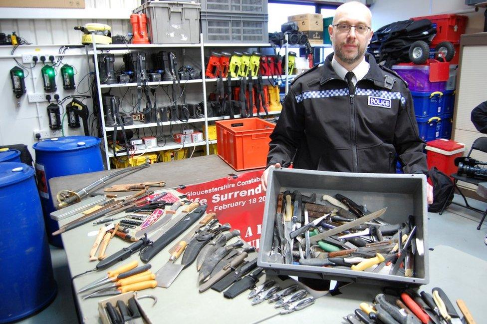 Insp Steve Wood with some of the knives collected by Gloucestershire Police