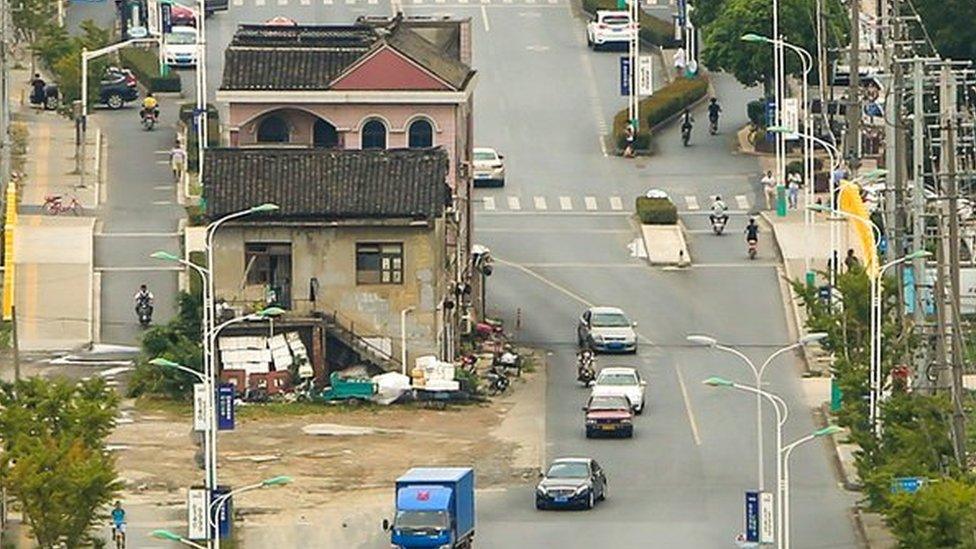 Shanghai house in the middle of a wide road