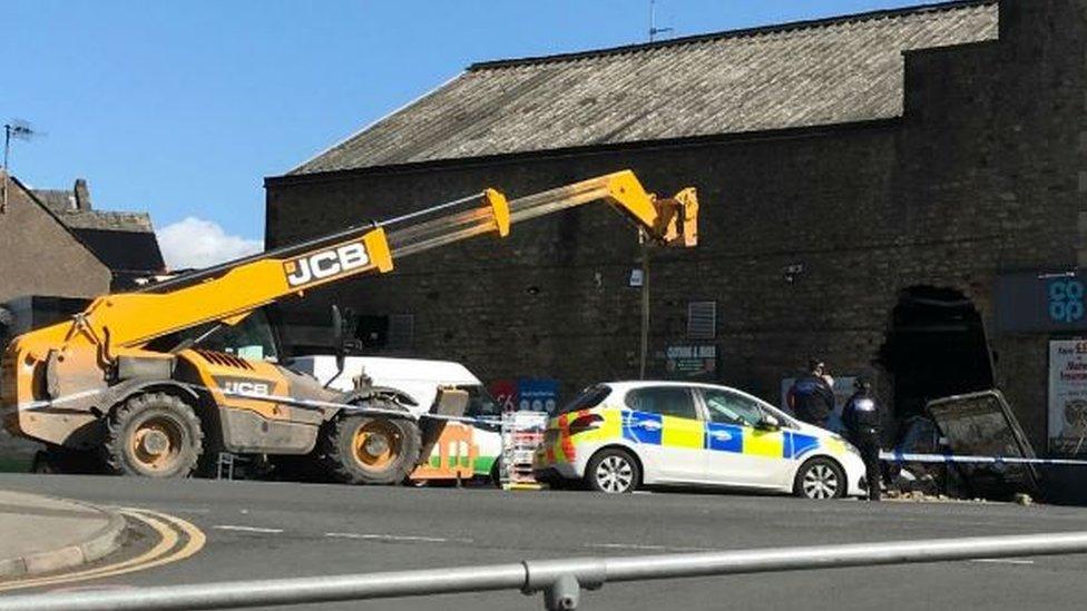 JCB outside supermarket