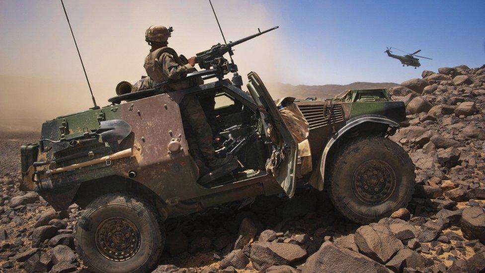 French soldier stands guard in an armoured vehicle the Terz valley in northern Mali