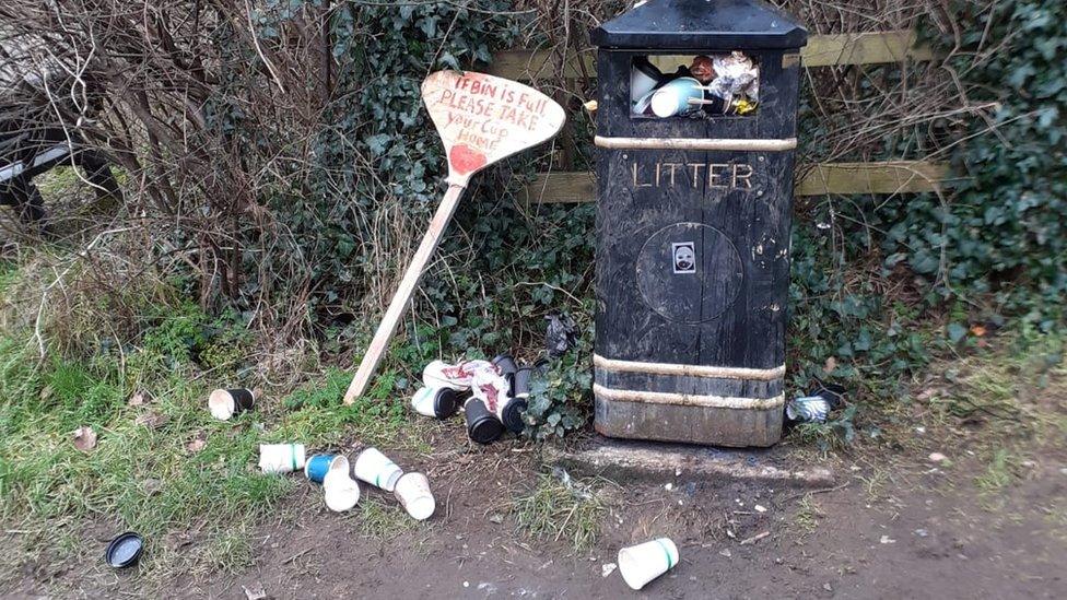 Overflowing litter bin