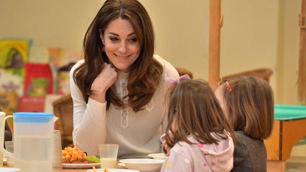 The Princess of Wales talks to two children on a visit to a nursery in January 2020