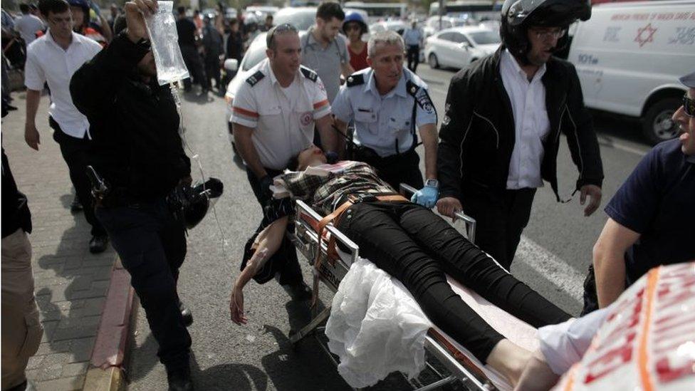 Injured suspected attacker wheeled away by Israeli medics in Jerusalem (12/10/15)