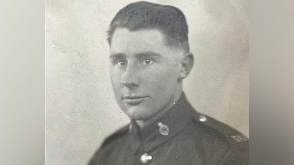 A black and white image of a younger Eric Page in military uniform