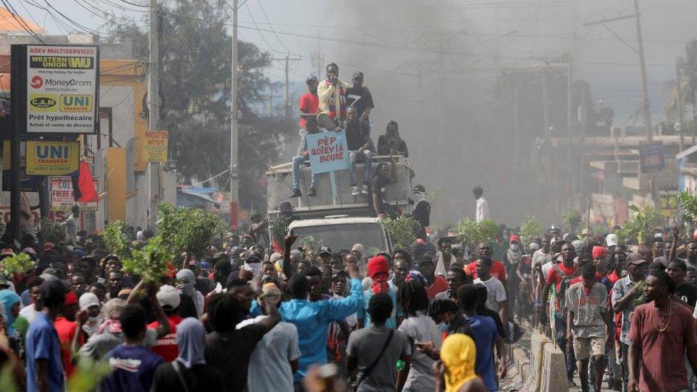 People take part in a protest demanding the resignation of Haiti's Prime Minister Ariel Henry after weeks of shortages, in Port-au-Prince, Haiti October 10, 2022