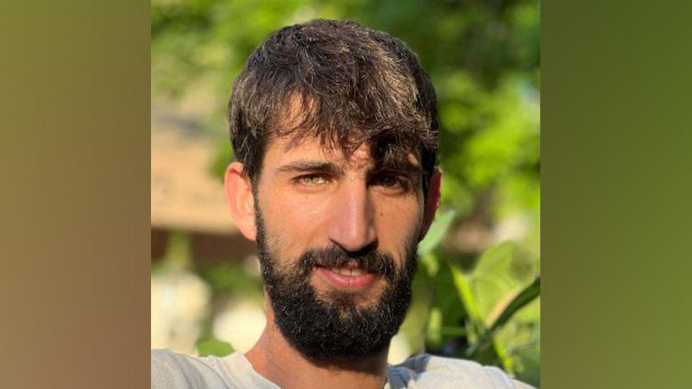 Guy Illouz. He has dark hair and a beard