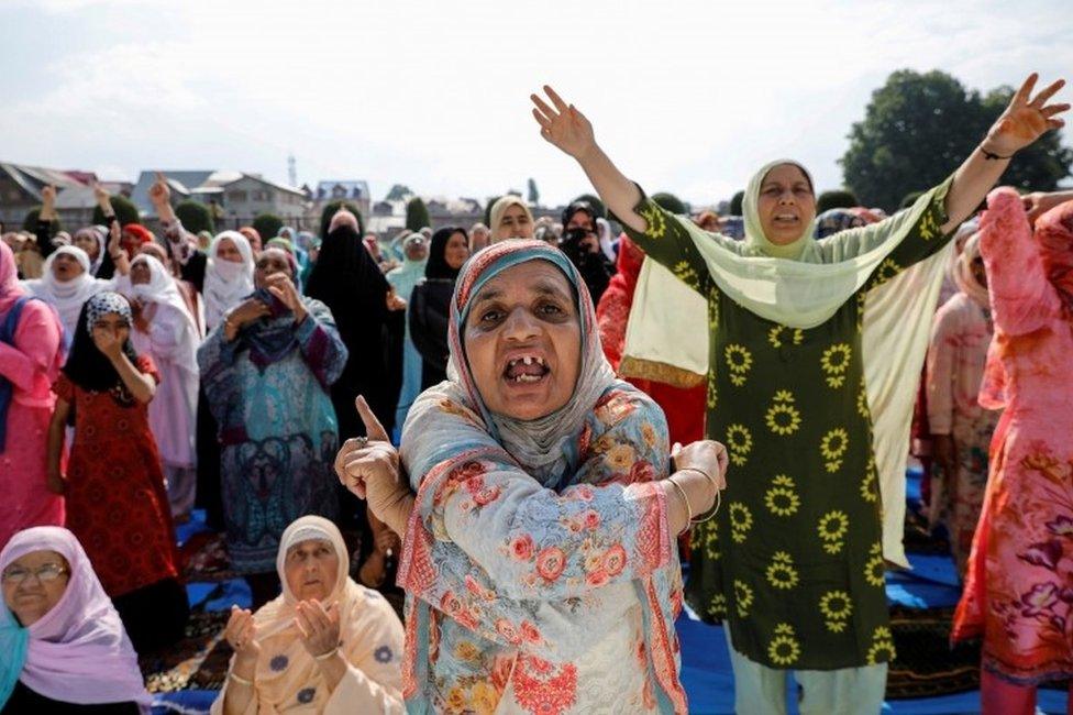 Kashmiri women shout pro-freedom slogans before offering the Eid-al-Adha prayers at a mosque during restrictions after the scrapping of the special constitutional status for Kashmir by the Indian government, in Srinagar, August 12, 2019