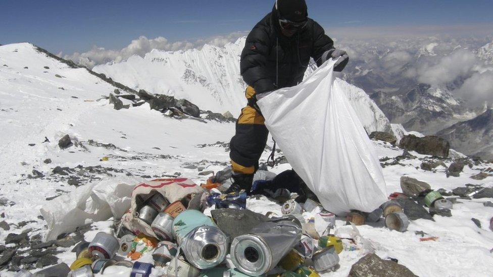 man-collecting-rubbish-on-mount-everest.