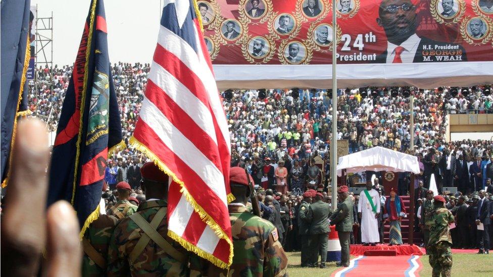 Liberia's former President Ellen Johnson Sirleaf and the new President elect George Weah are seen during his swearing-in ceremony at the Samuel Kanyon Doe Sports Complex in Monrovia, Liberia, January 22, 2018.