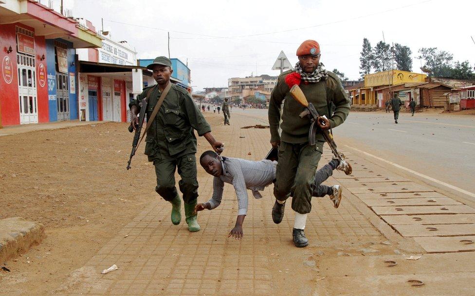 Congolese soldiers arrest a civilian protesting against the government's failure to stop the killings and inter-ethnic tensions in the town of Butembo, in North Kivu province, Democratic Republic of Congo, 24 August 2016.