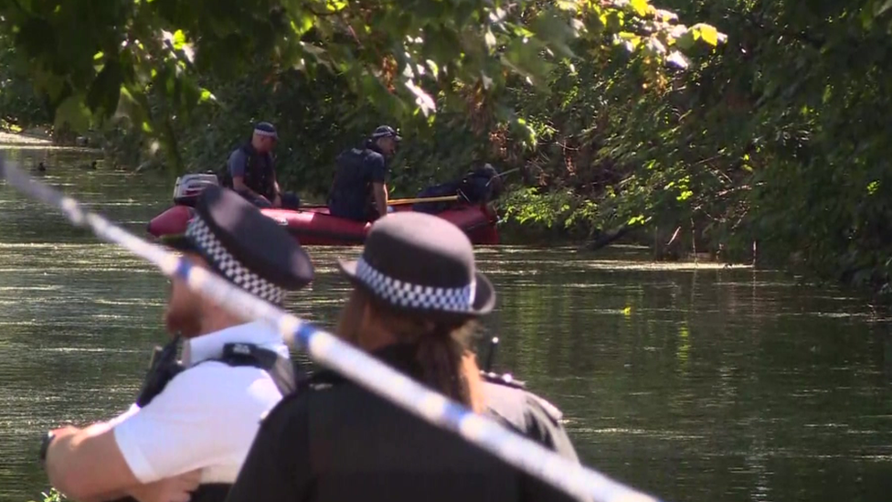 Police at the canal - some in a boat -searching the area in Southwall