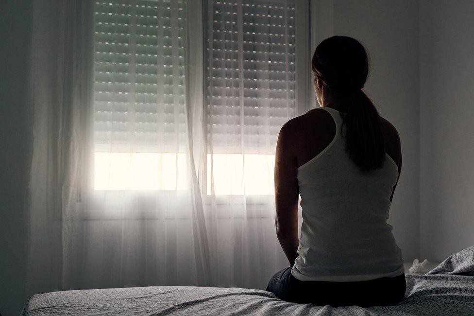 Stock image of woman on bed