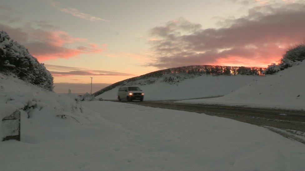 Van on snowy road