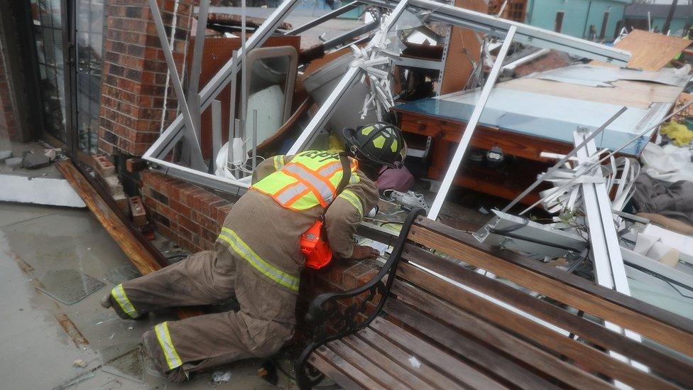 A Rockport firefighter goes door to door on a search and rescue mission as he looks for people that may need help