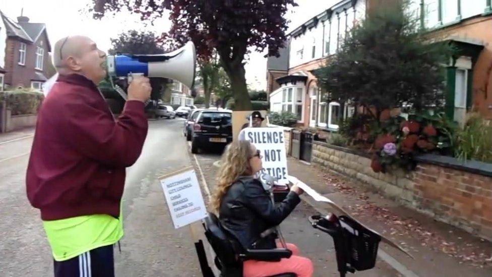 Mickey Summers protesting outside a council officer's house