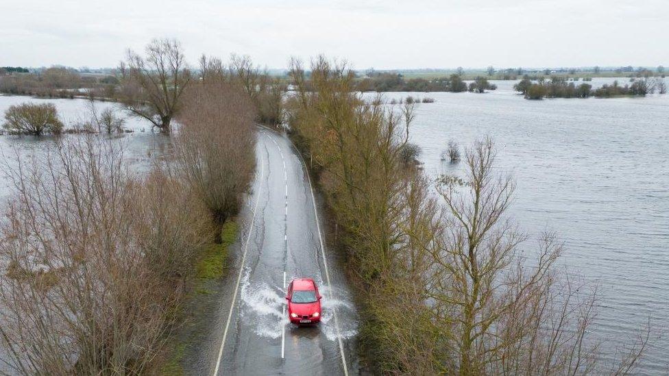 A car driving on a wet road