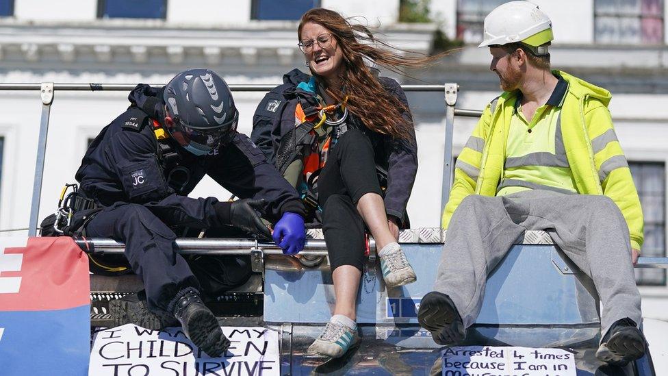 Specialist teams work to free an Insulate Britain protester