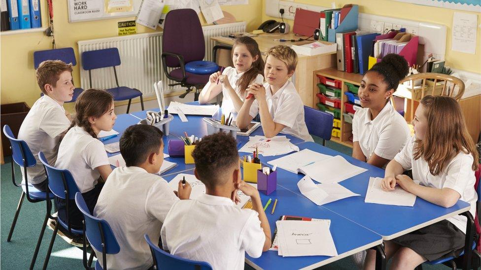 children talking in class