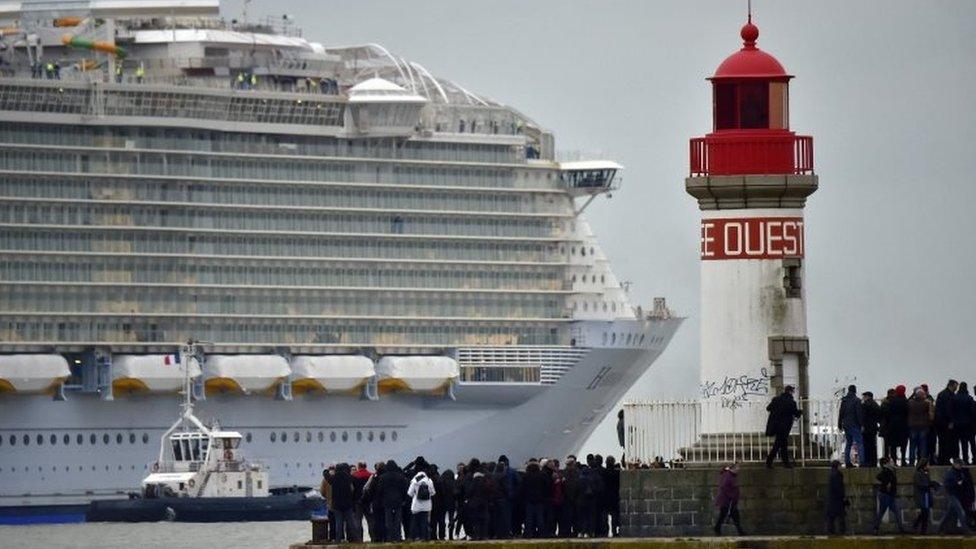 People watch as Harmony of the Seas leaves Saint-Nazaire. Photo: 10 March 2016