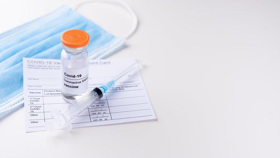 Covid-19 vaccine and syringe