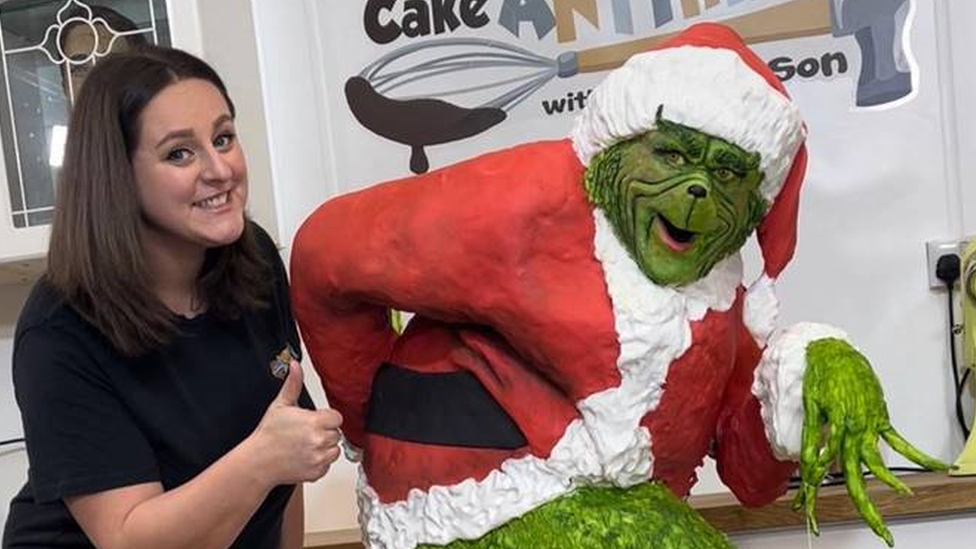 Lara Mason and giant Grinch cake