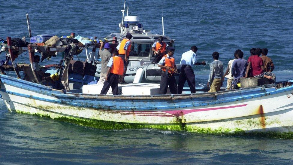 An undated picture shows Yemeni coast guards checking a small boat with refugees arriving from Somalia to the Yemeni port city Aden. According to the United Nations High Commissioner for Refugees (UNHCR) around 1,500 African refugees have made it to Yemeni shores after risky voyages in rough conditions to flee civil was in their country.