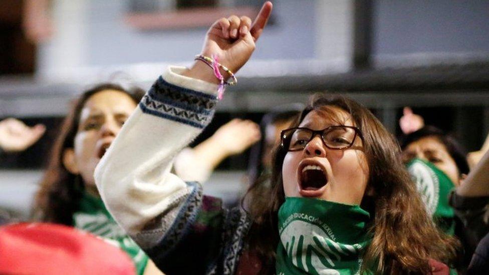 Pro-choice demonstrators react during a protest outside the National Assembly